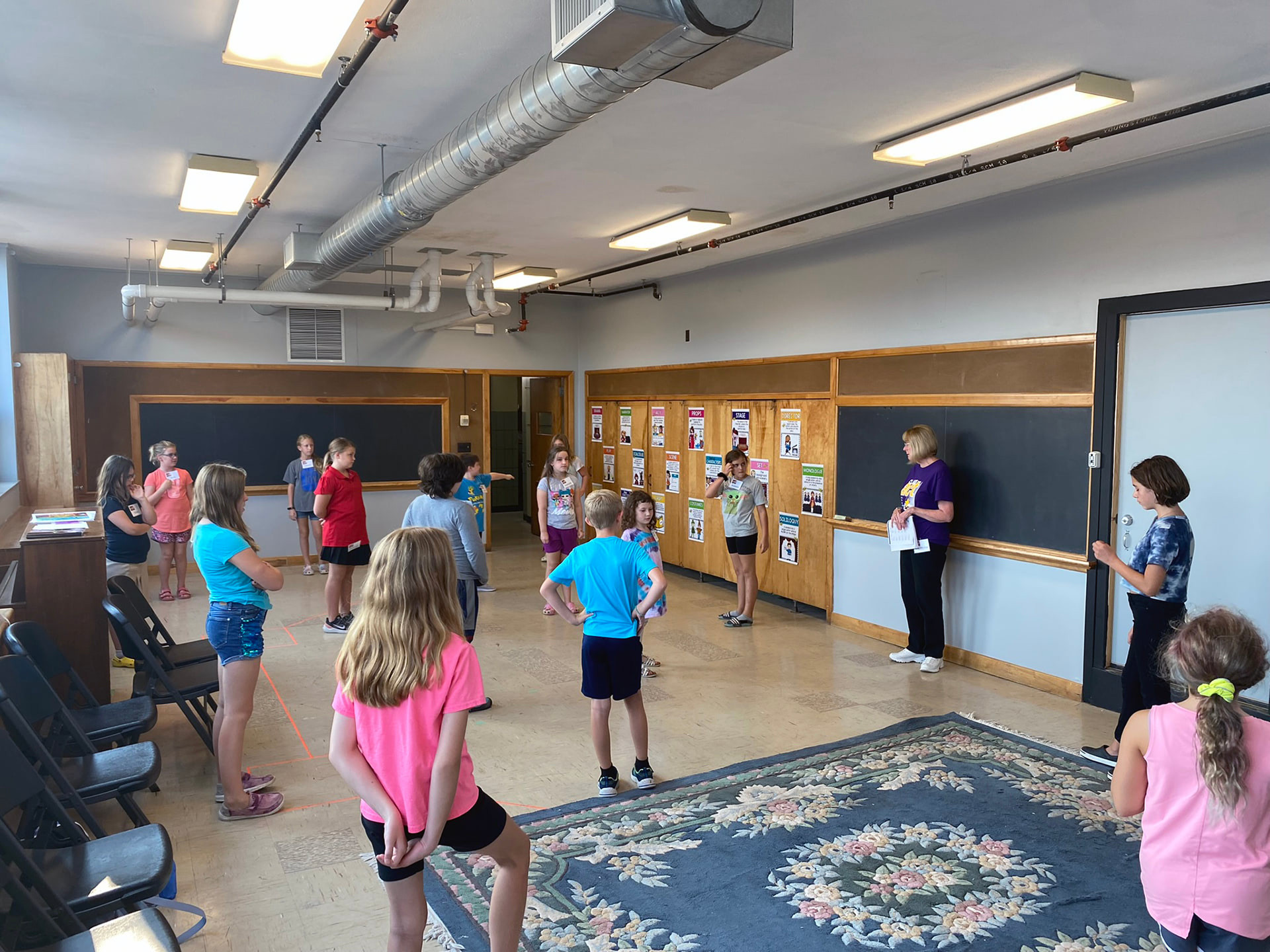 A children's class meeting in the loft.