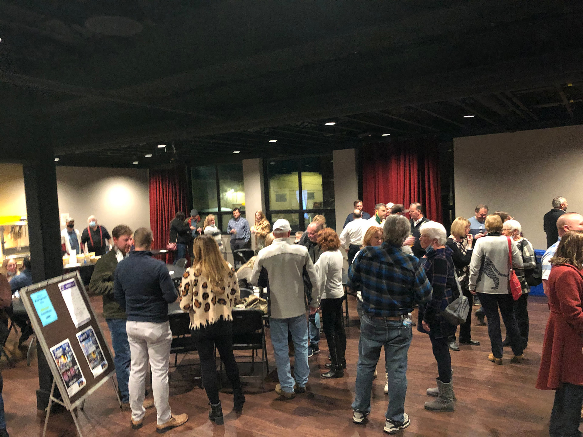People socializing in BDACT Encore Hall